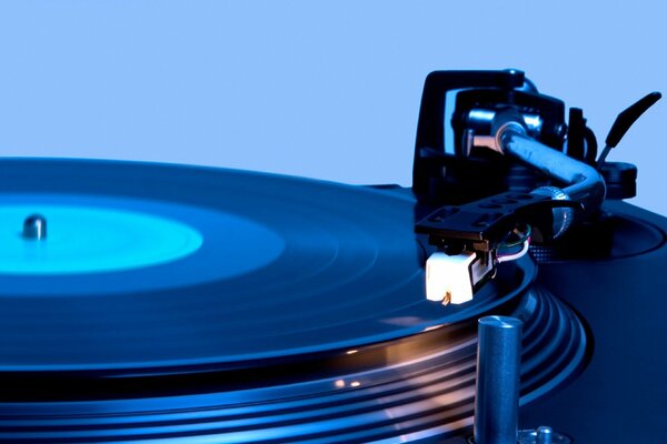 Turntable with a record in a blue background