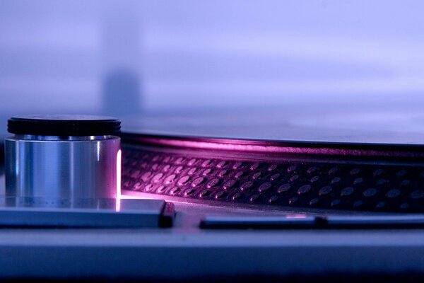 DJ s turntable with pink backlight