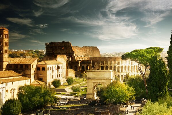 Roman Colosseum on the background of trees