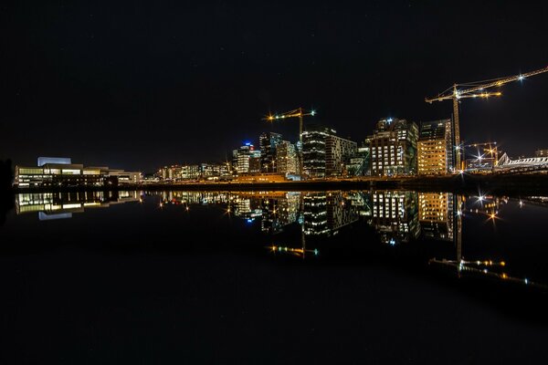 A night city and a river reflecting lights