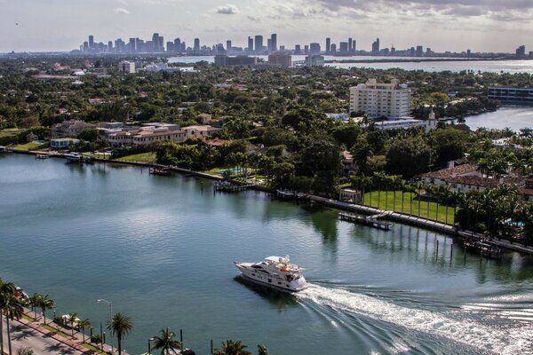 The yacht glides on the water surface