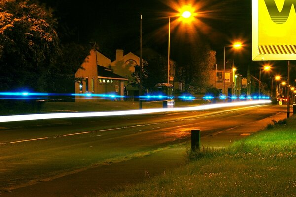 Night city, street lit by lanterns