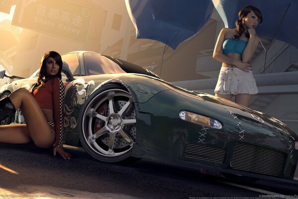 Two girls at the tuning car