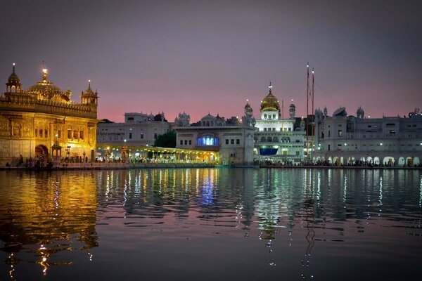 Indian temple in the reflection of the night city