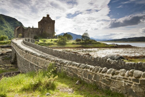 Charming bridge to Eilean Donan Castle in Scotland