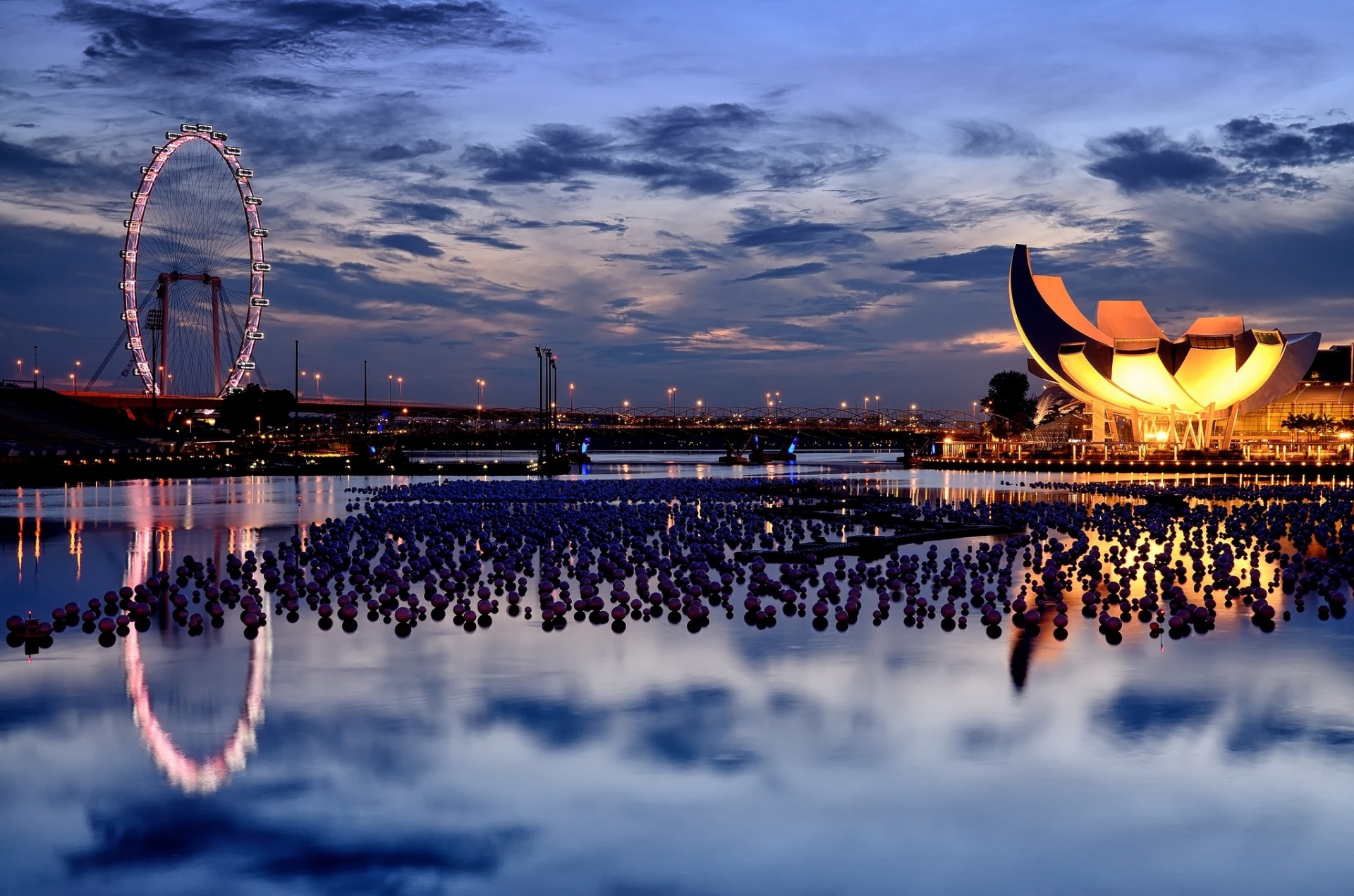 clouds sunset bridge water night sky ferris wheel singapore