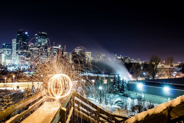 Park in the night city in winter