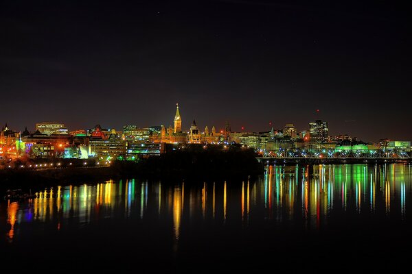 Canada s night city is reflected in the water