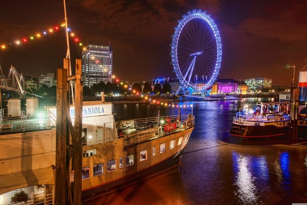 Panorama of the London river in the evening lights