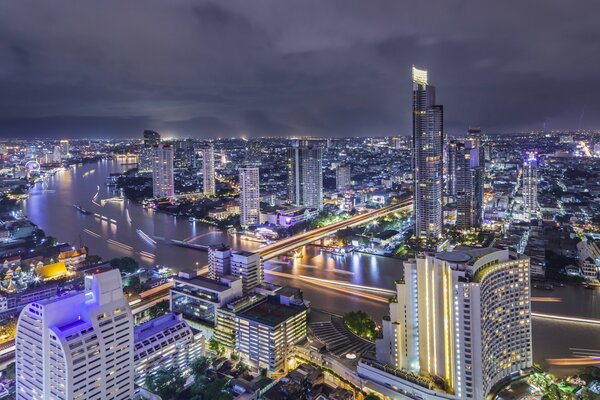 Night Bangkok: embankment and high-rises