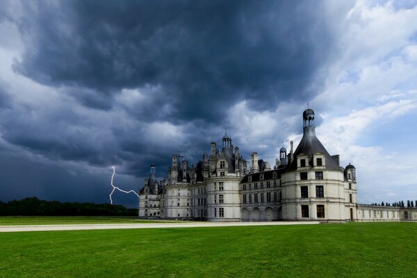 Chambord castle on a lightning background