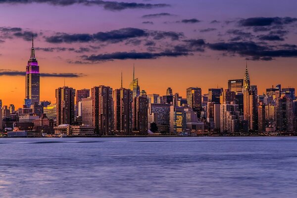 Manhattan at sunset and night lights