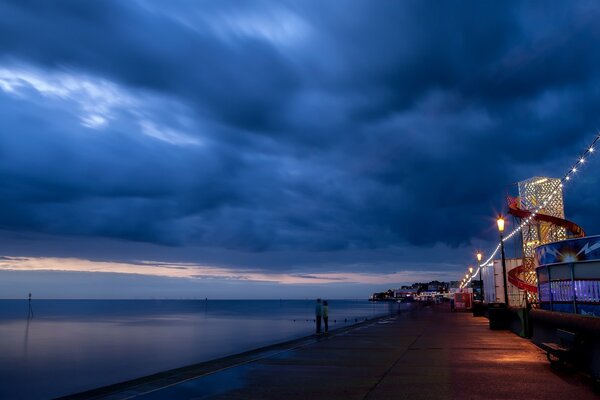 Walk along the evening embankment before the rain