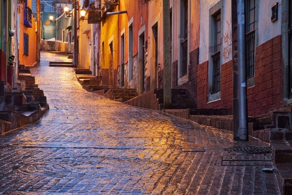 Cobblestone street in the light of lanterns