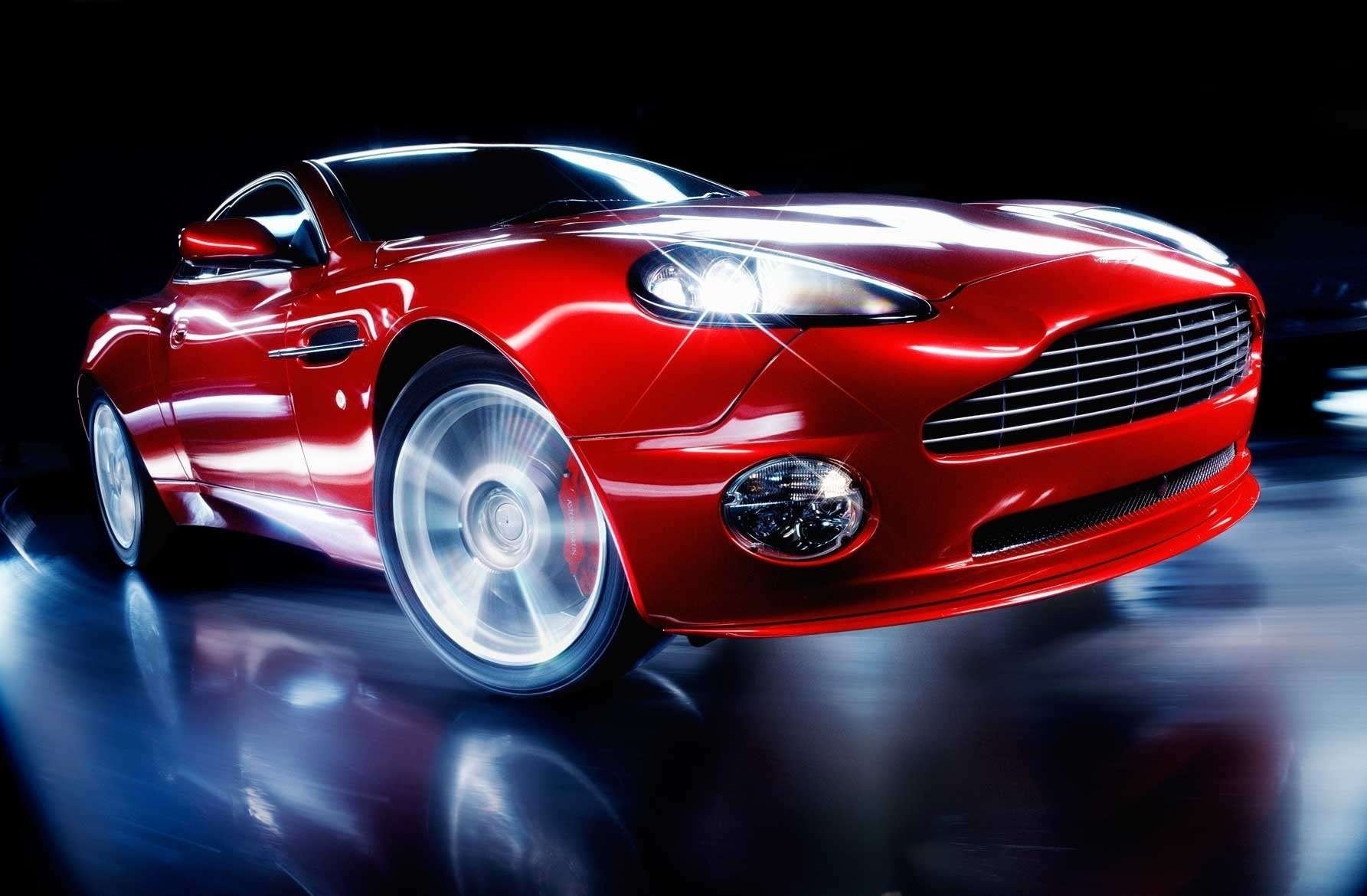 red aston martin the glare of the lights of headlights headlight light turn speed blur shine luxury auto red car cool car sports car transport vehicles form style design exhibition lights aston martin