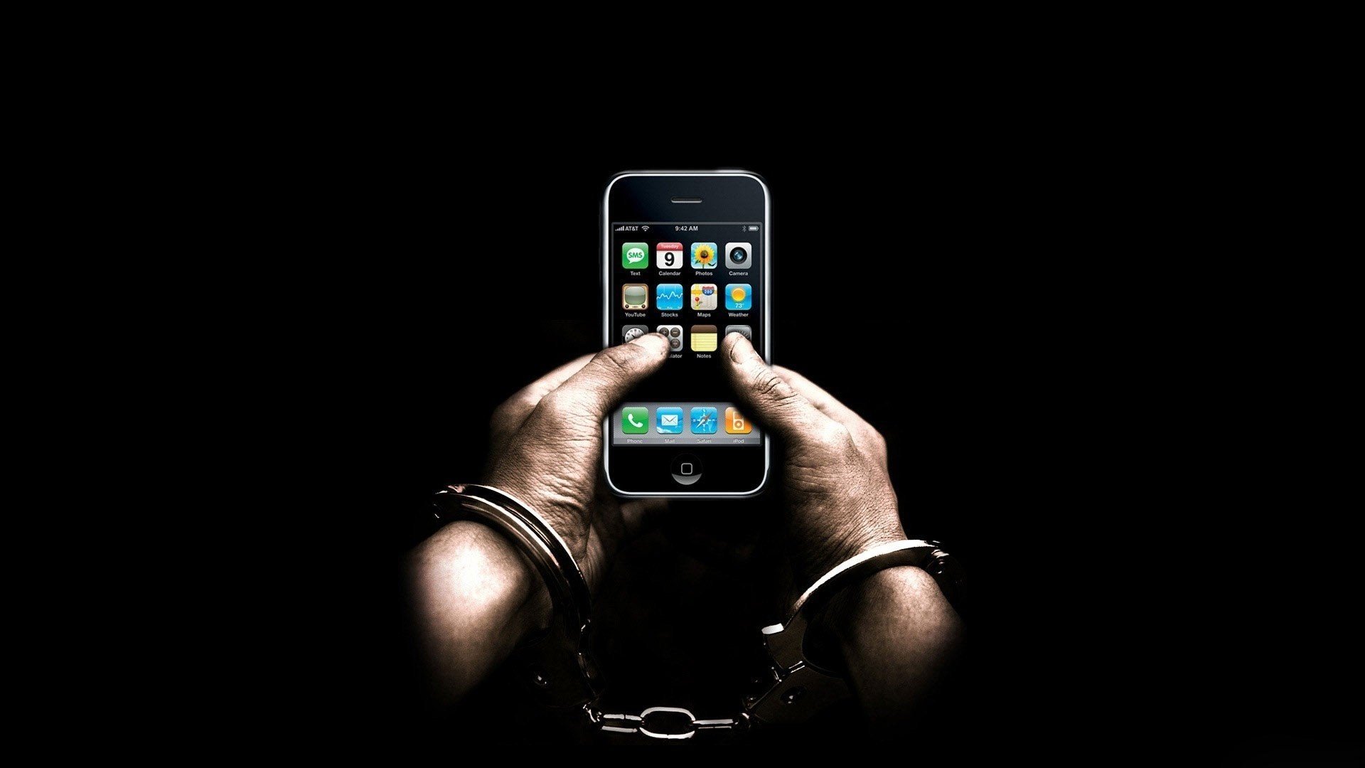 handcuffs male hands phone