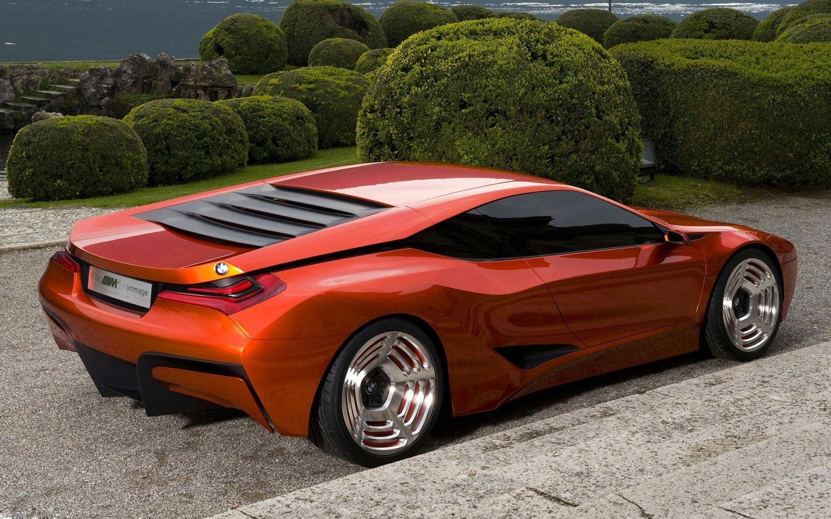 m1 hommage concept coche de hombre bmw naranja llantas cromadas bmw arbustos verdes perfil carretilla fresca autos deportivos vehículos automóviles vehículos de motor forma estilo diseño ruedas