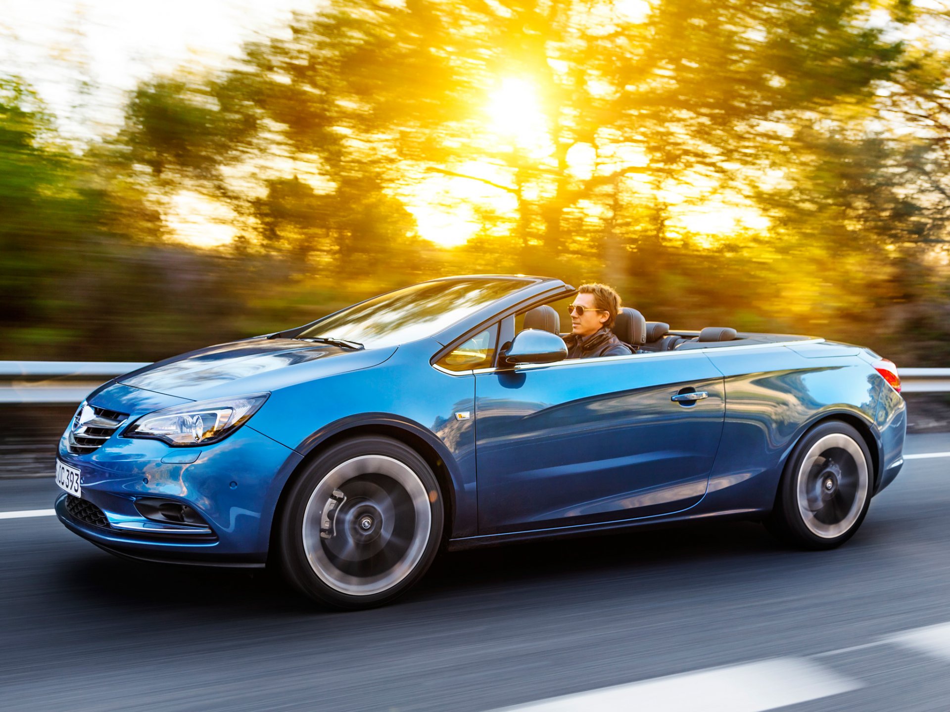 opel cascada automobile strada sole luce