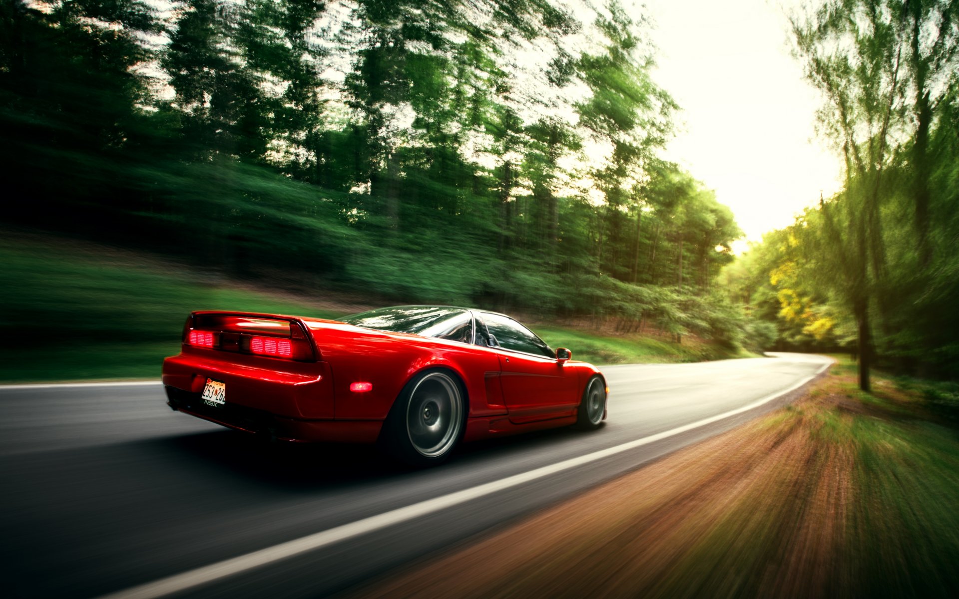 honda nsx rosso auto in movimento