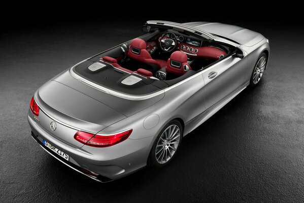 Silver Mercedes convertible with red interior