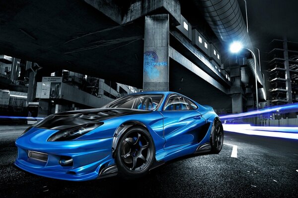 Niebieski samochód sportowy w nocy