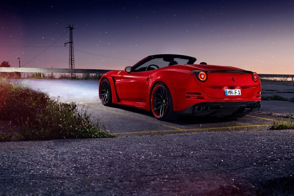 Red Ferrari car on the roads in California