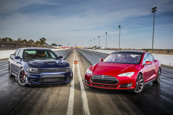 Tesla Rossa modello s e caricatore blu p85d