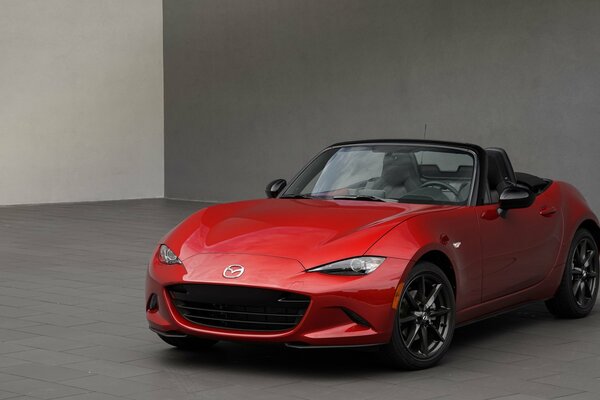 Red Mazda open-top car