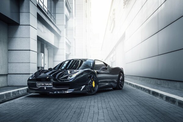 The Ferrari has wheels with yellow discs