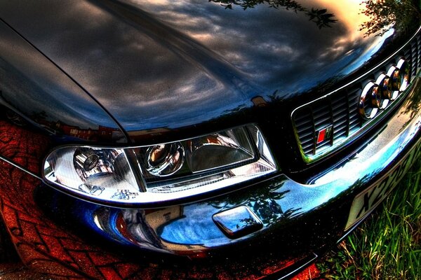 Hood of a black Audi with rings