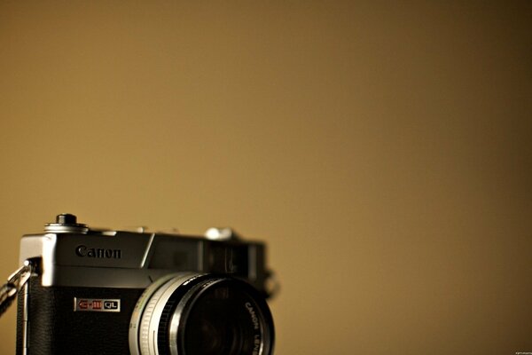 Photo of a camera on a beige background