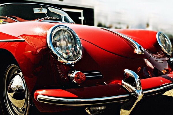 Red retro convertible with round headlights