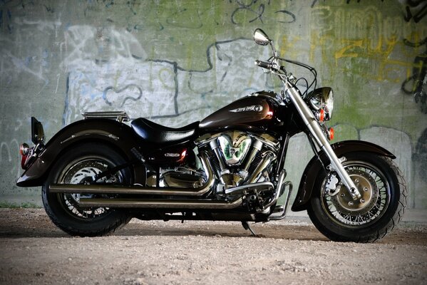 Black motorcycle bike on wall background