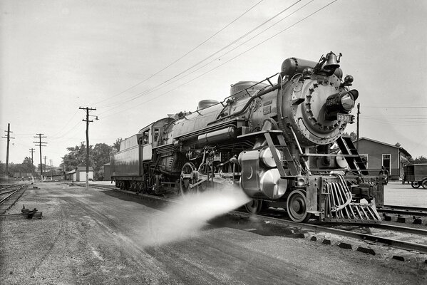 Old railway transport goes home on the road, black and white picture