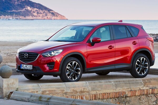 Mazds cx-5 red car on the bay shore