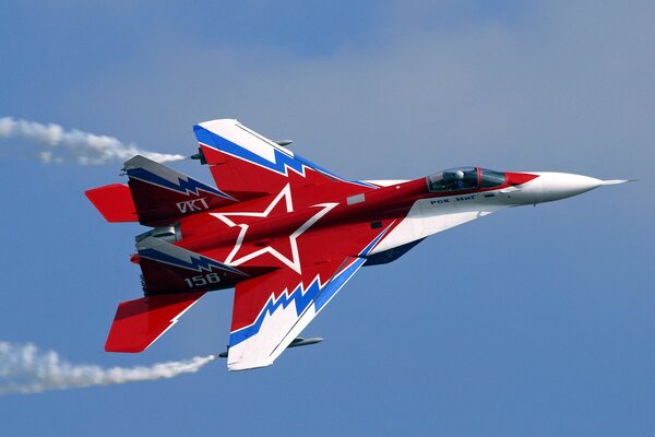 A red plane on a blue sky background