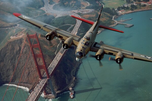 Passenger plane on the background of the golden gate