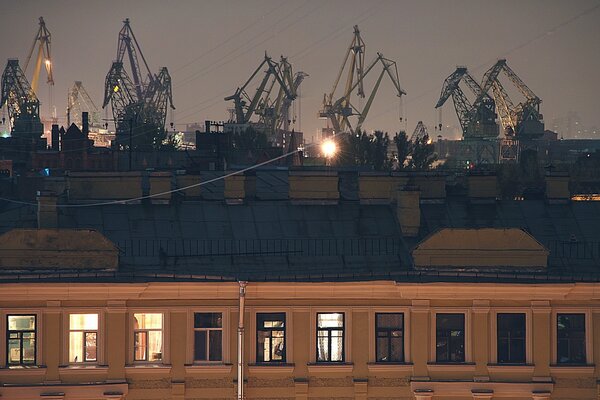 Construction cranes over residential buildings
