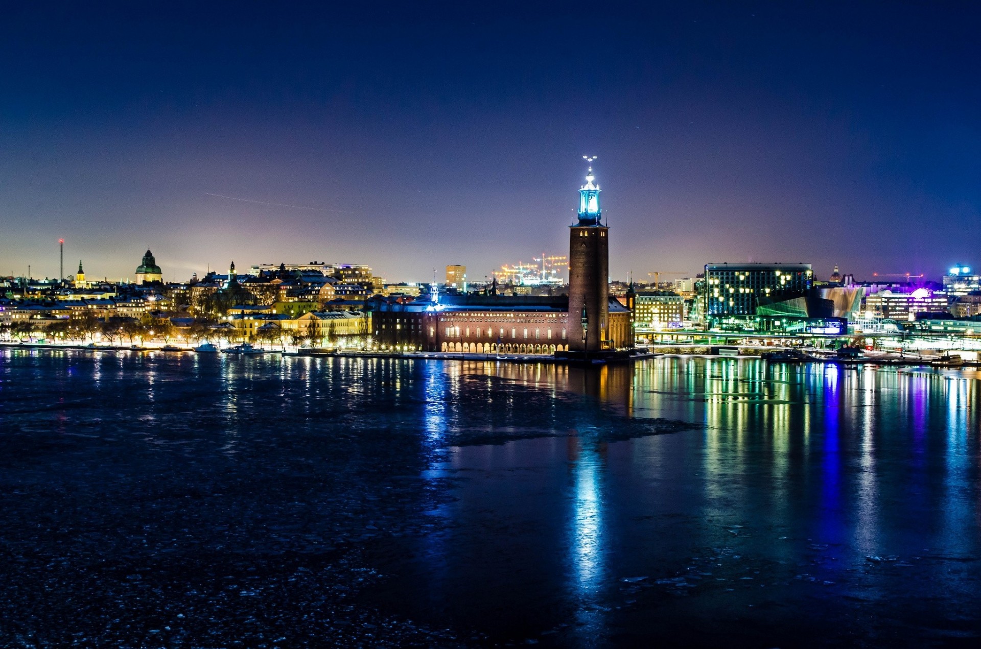 lights night town hall reflection sweden stockholm winter