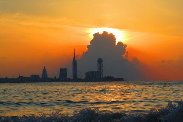 Sunset in the city on the sea coast