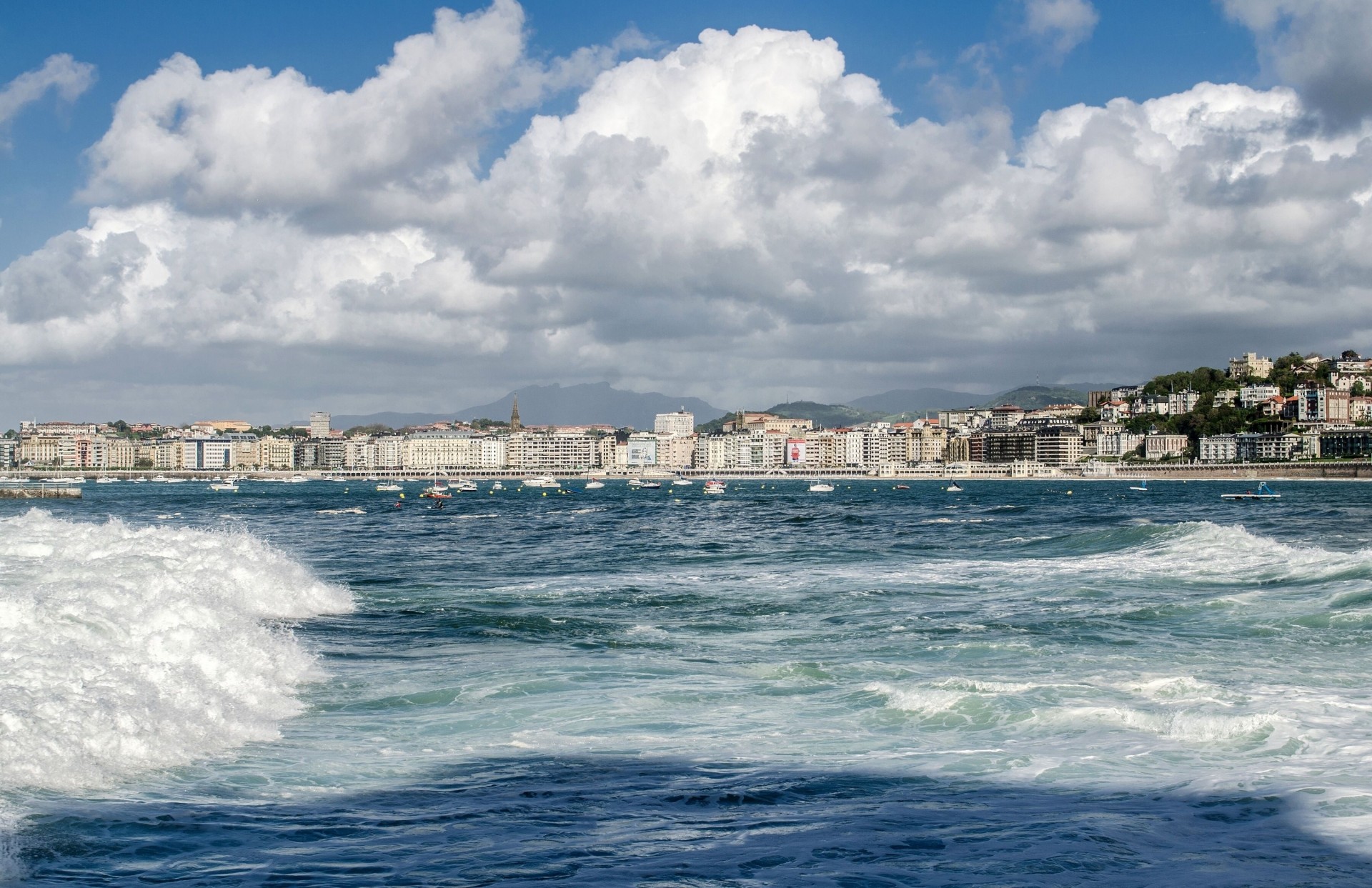 yacht boat wave clouds spain