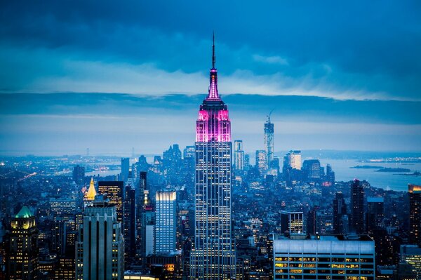 The lights of the Empire State Building Skyscraper in the evening haze