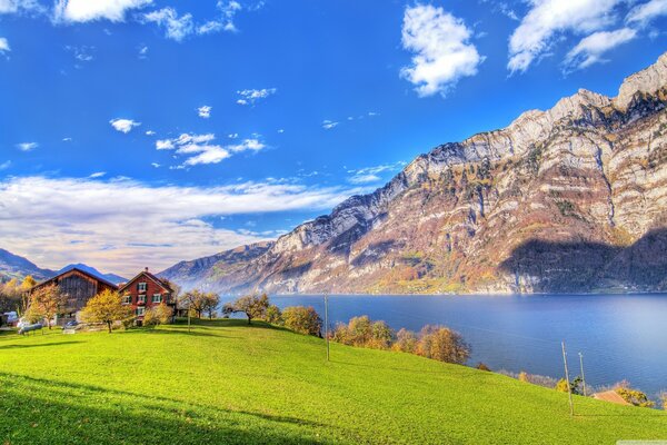 Farm house near mountains and river