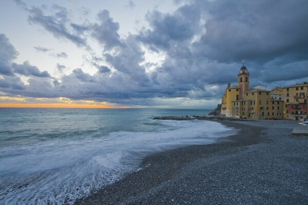 Church on the seashore. Lush clouds