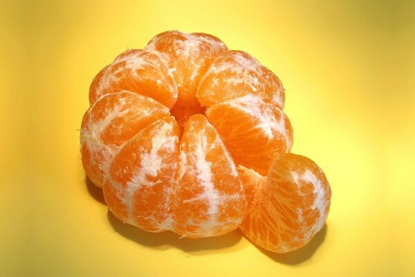 Macro fruit tangerine with a slice