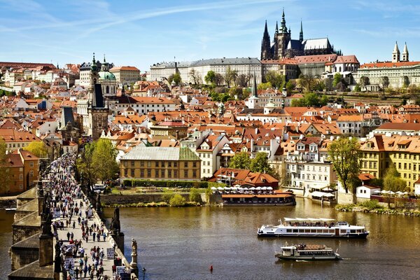 Buildings on the embankment in Prague at Charles Bridge