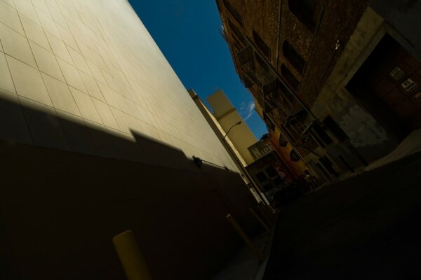 A dark alley among buildings and skyscrapers