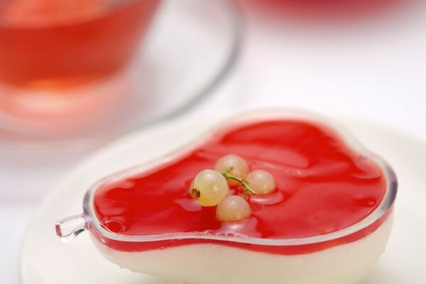 A beautiful jelly dessert with a sprig of currant