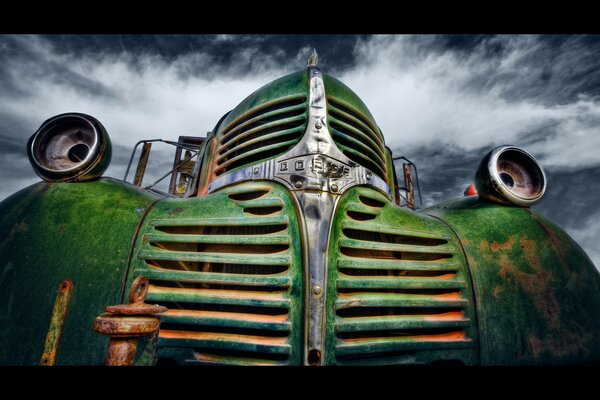 Retro car green covered with rust