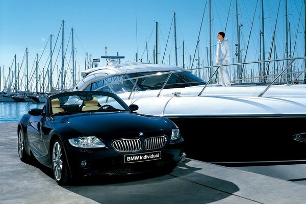 A white yacht and a black BMW from a rich man